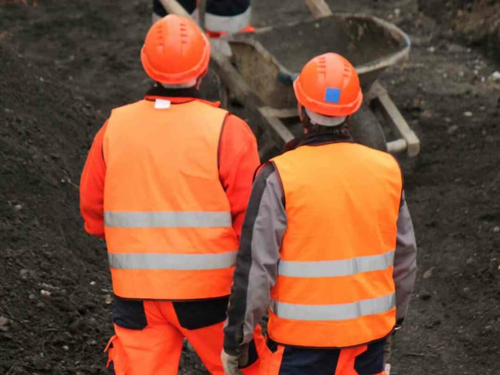 rail workers in orange PPE